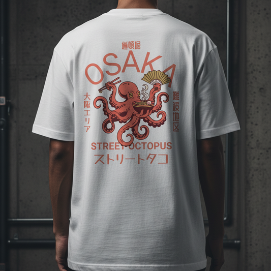 Person wearing a white t-shirt with red and brown graphic design on the back, featuring the word 'Osaka' and an octopus.