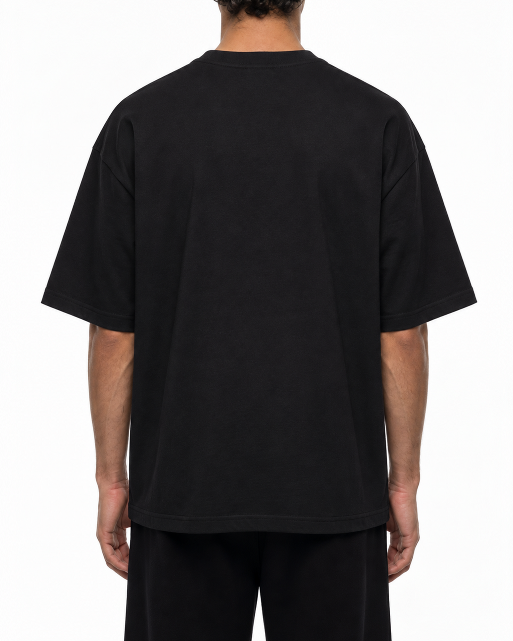 Plain back of the black Belarté Odyssey Warrior T-shirt on a model