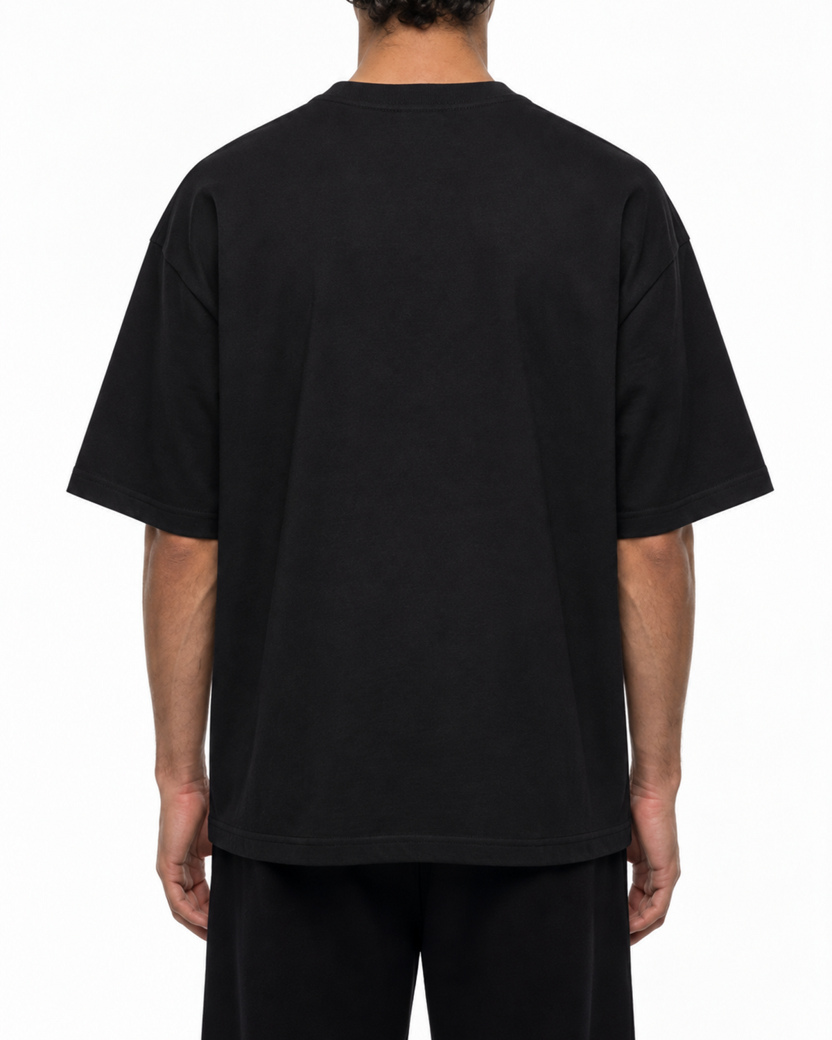 Plain back of the black Belarté Odyssey Warrior T-shirt on a model