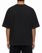 Plain back of the black Belarté Six Seven T-shirt on a model