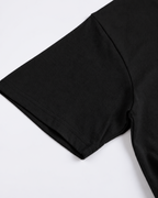 Close-up of the sleeve and stitching on the black Belarté Six Seven T-shirt