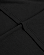 Close-up of the collar seam on the black Belarté Six Seven T-shirt